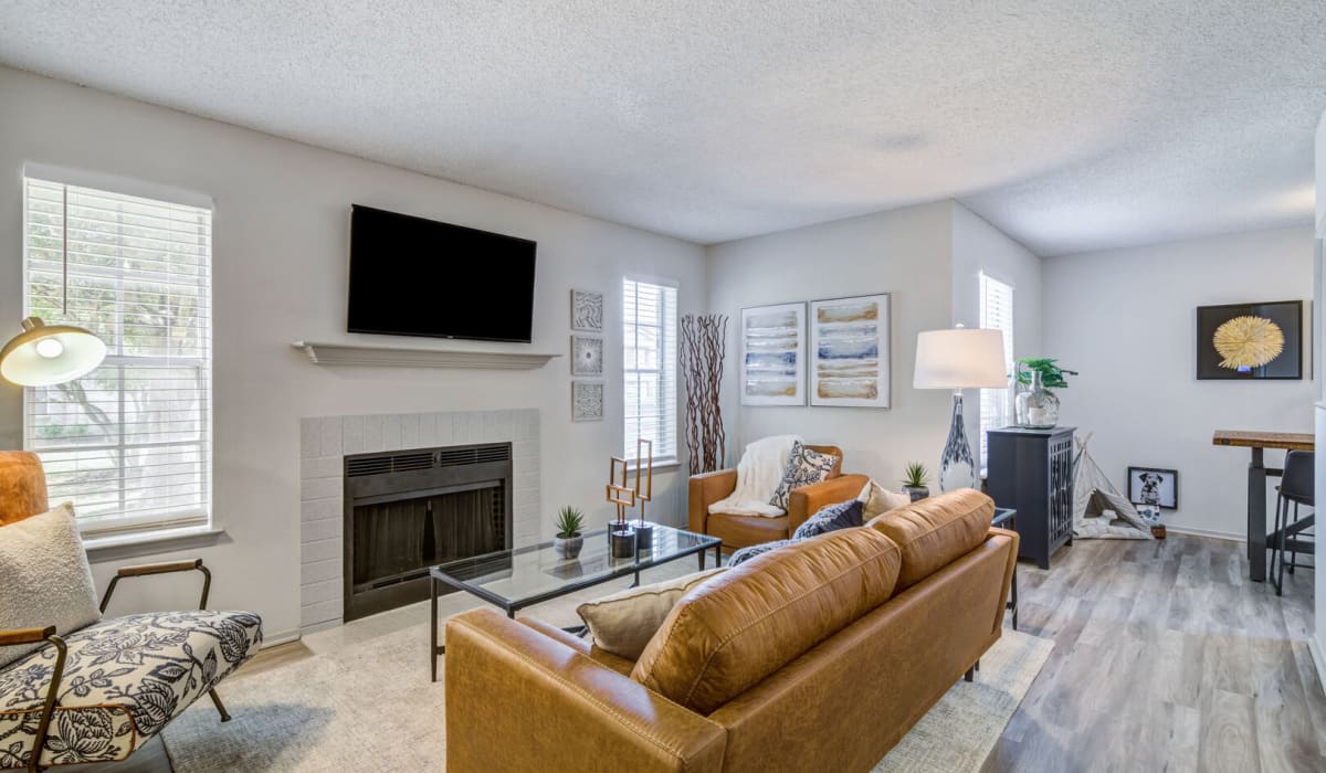 living room with fireplace at Belmont Estates in Arlington, Texas