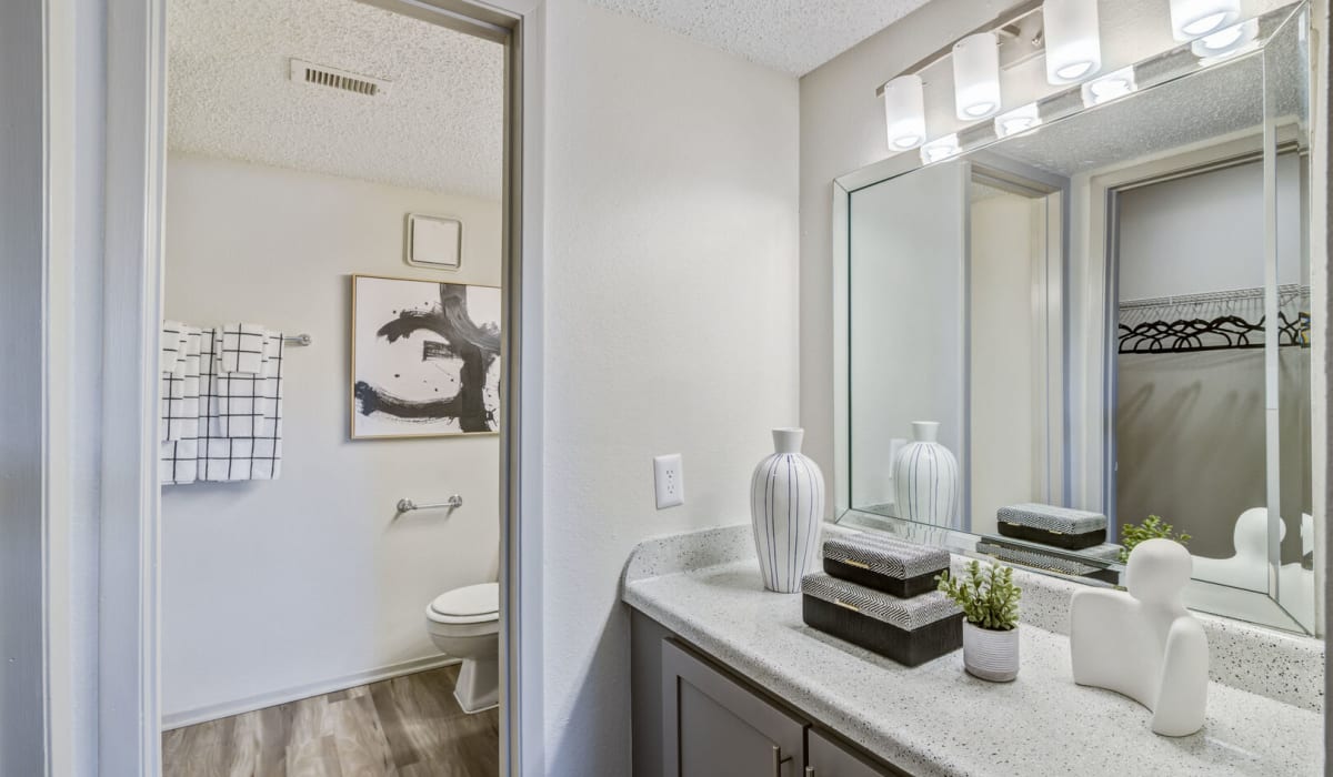 bathroom with door at Belmont Estates in Arlington, Texas