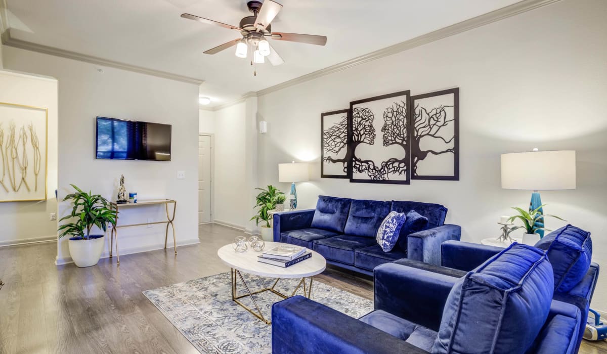 Living room with ceiling fan at Hilltop at Shavano in San Antonio, Texas