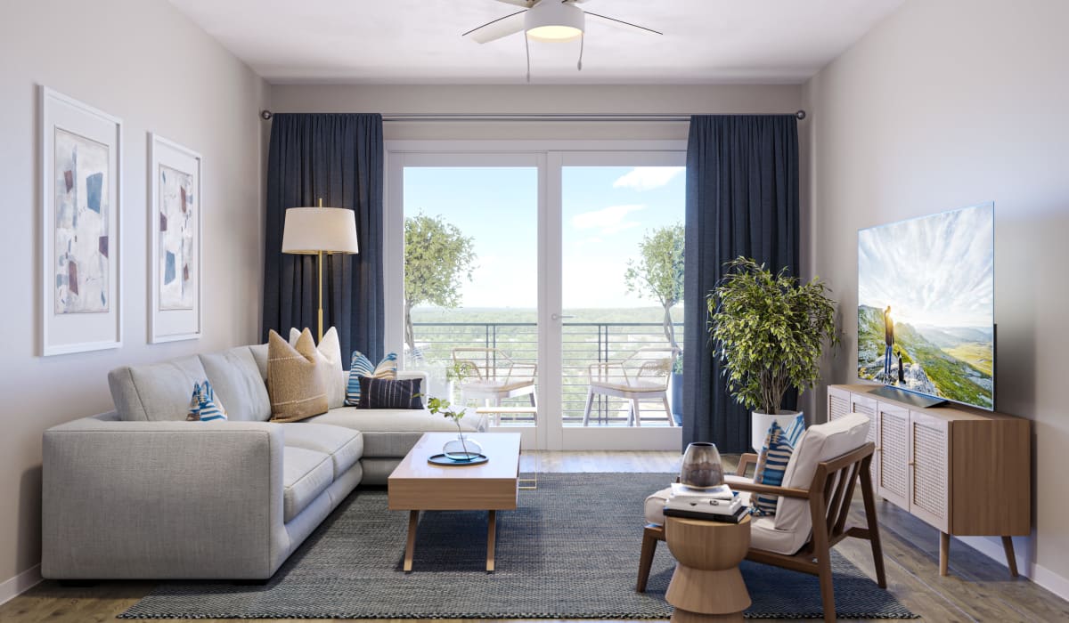 Luxury Apartments In Folsom Ranch - Spacious Living Room With Wood-Style Plank Flooring, Ceiling Fan, And Access To Balcony Through Glass Doors.