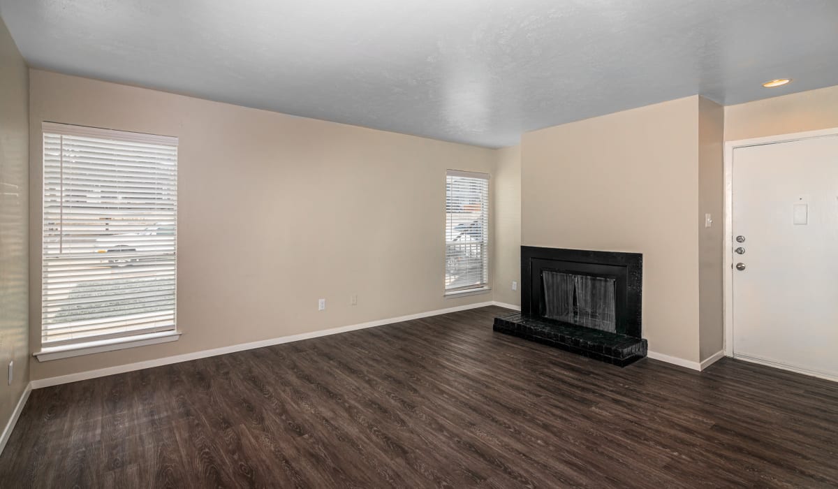 Living room with fireplace at Barrett Apartment Homes in Garland, Texas