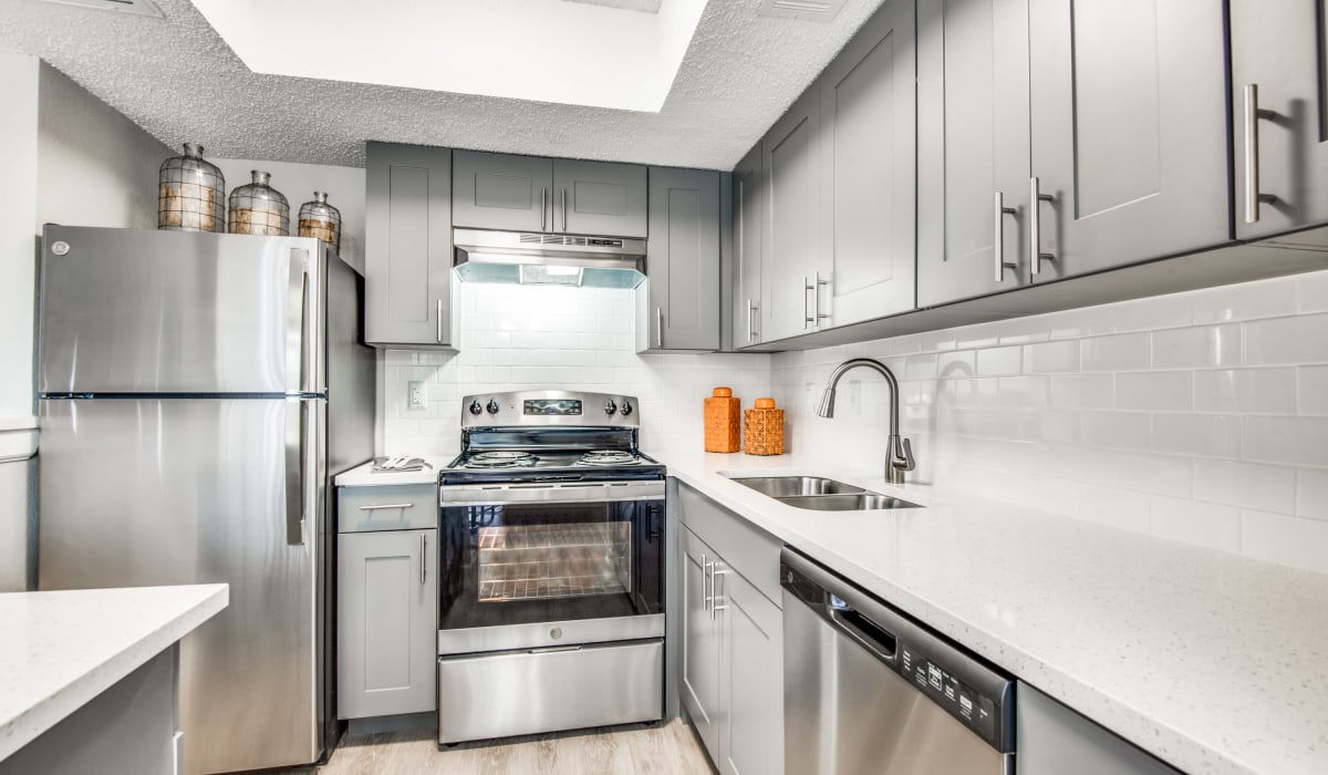 Kitchen with marble countertops at Birch Apartment Homes in Dallas, Texas