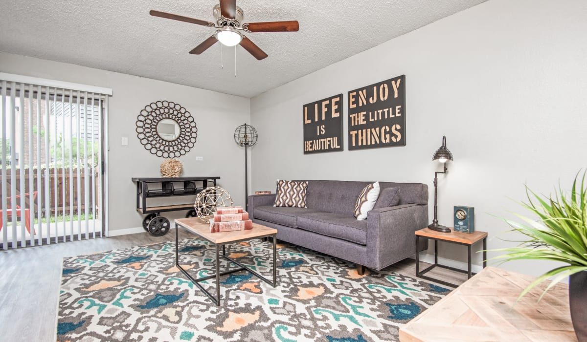 Living room with fan at Birch Apartment Homes in Dallas, Texas