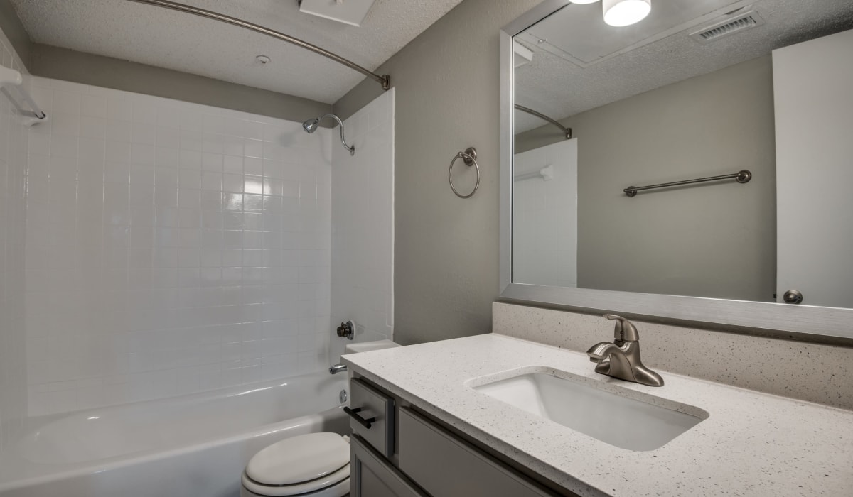 Bathroom with nice counter at Hawke Apartment Homes in Irving, Texas