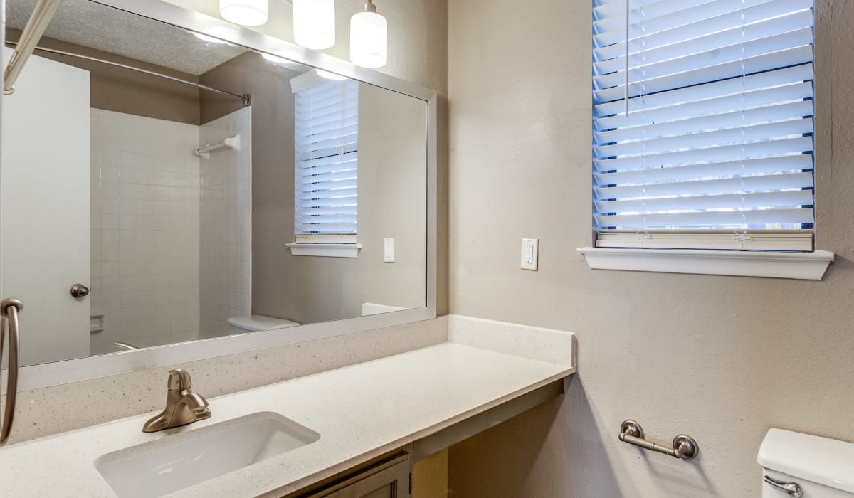 Bathroom with modern details at Knowlton Apartment Homes in Mesquite, Texas
