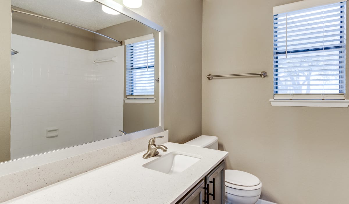 Bathroom with nice counters at Knowlton Apartment Homes in Mesquite, Texas
