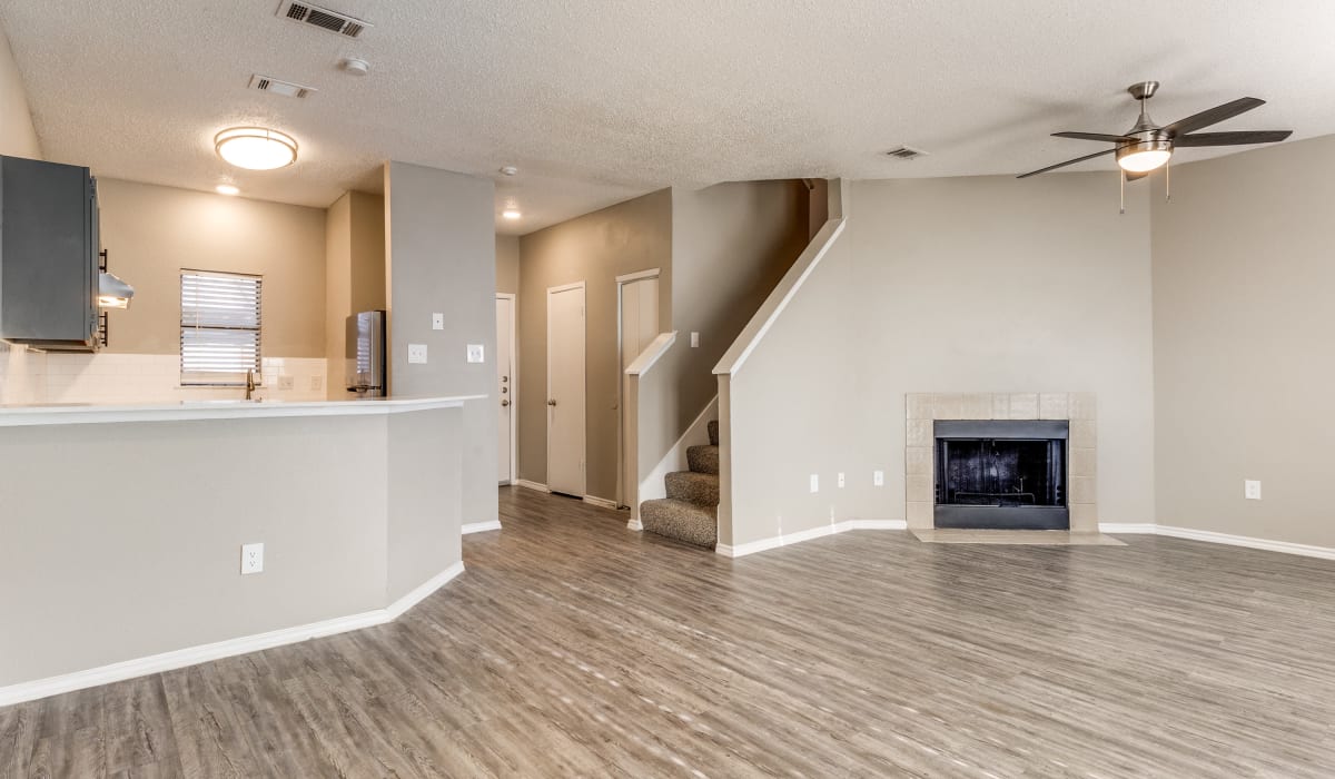 Living room with fireplace at Knowlton Apartment Homes in Mesquite, Texas