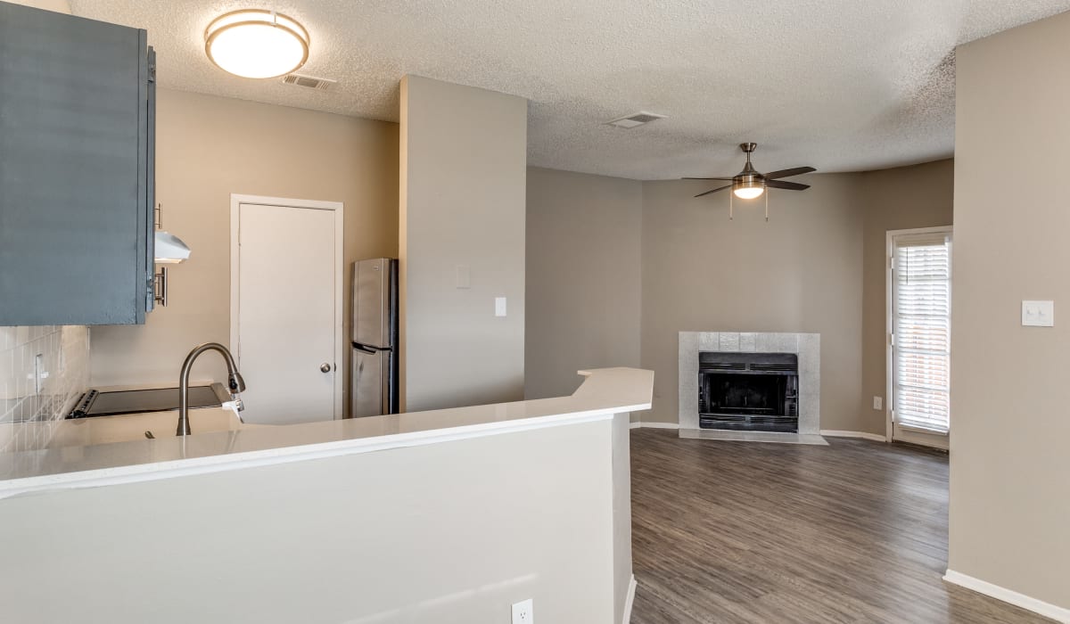 Kitchen and fireplace at Knowlton Apartment Homes in Mesquite, Texas