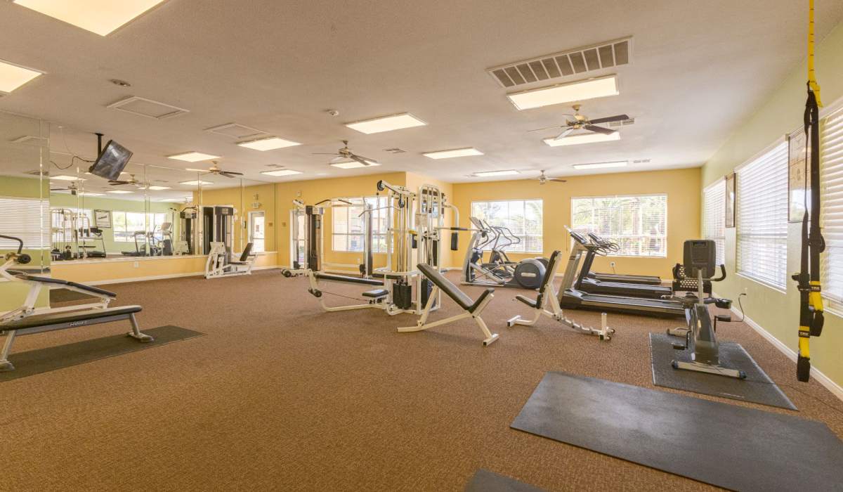 Fitness center with large windows at La Serena at the Heights in Henderson, Nevada