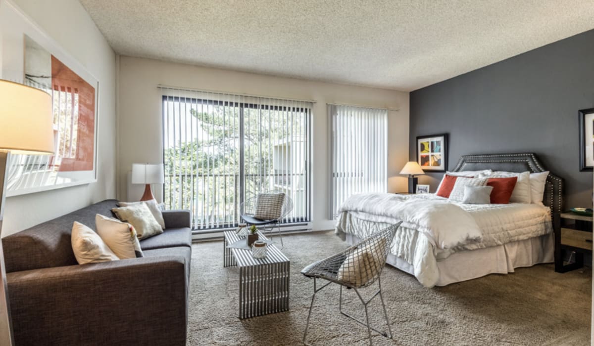 Master bedroom with private balcony at Lakewood Apartments at Lake Merced in San Francisco, California