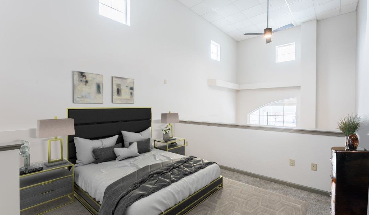 Lofted bedroom with high ceilings at Greenwood Cove Apartments in Rochester, New York