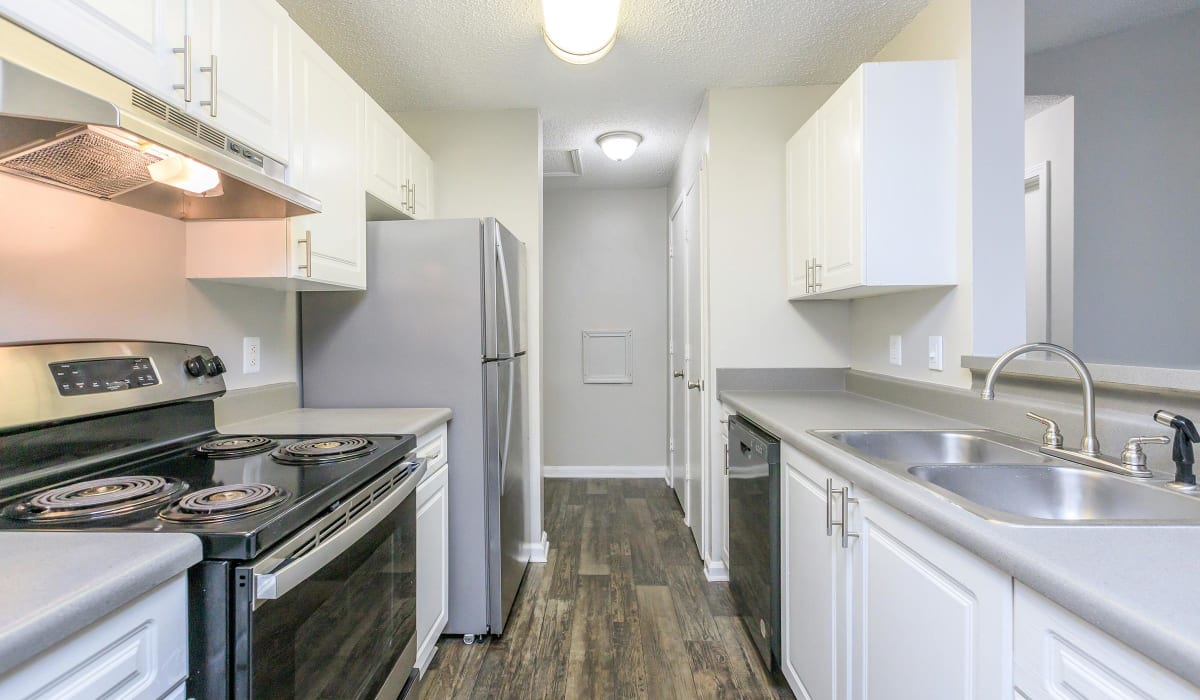 White cabinets in an apartment kitchen at The Peaks at Callier Springs in Rome, Georgia