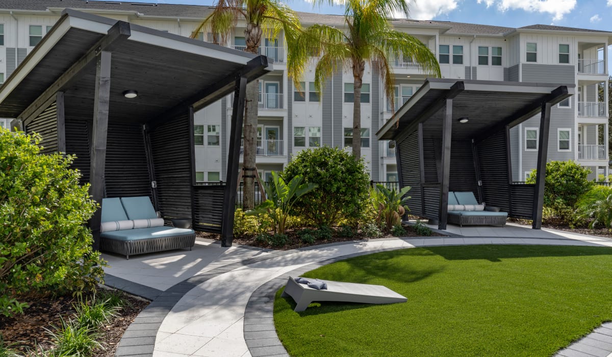 Covered seating in the poolside cabanas at Sentosa Riverview in Riverview, Florida