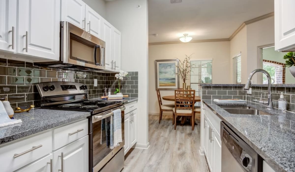 Kitchen with backsplash at Sonterra Heights in San Antonio, Texas