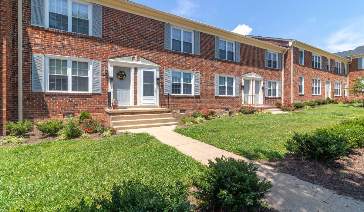 Apartment building with sidewalk at Landmark at Patterson in Richmond, Virginia