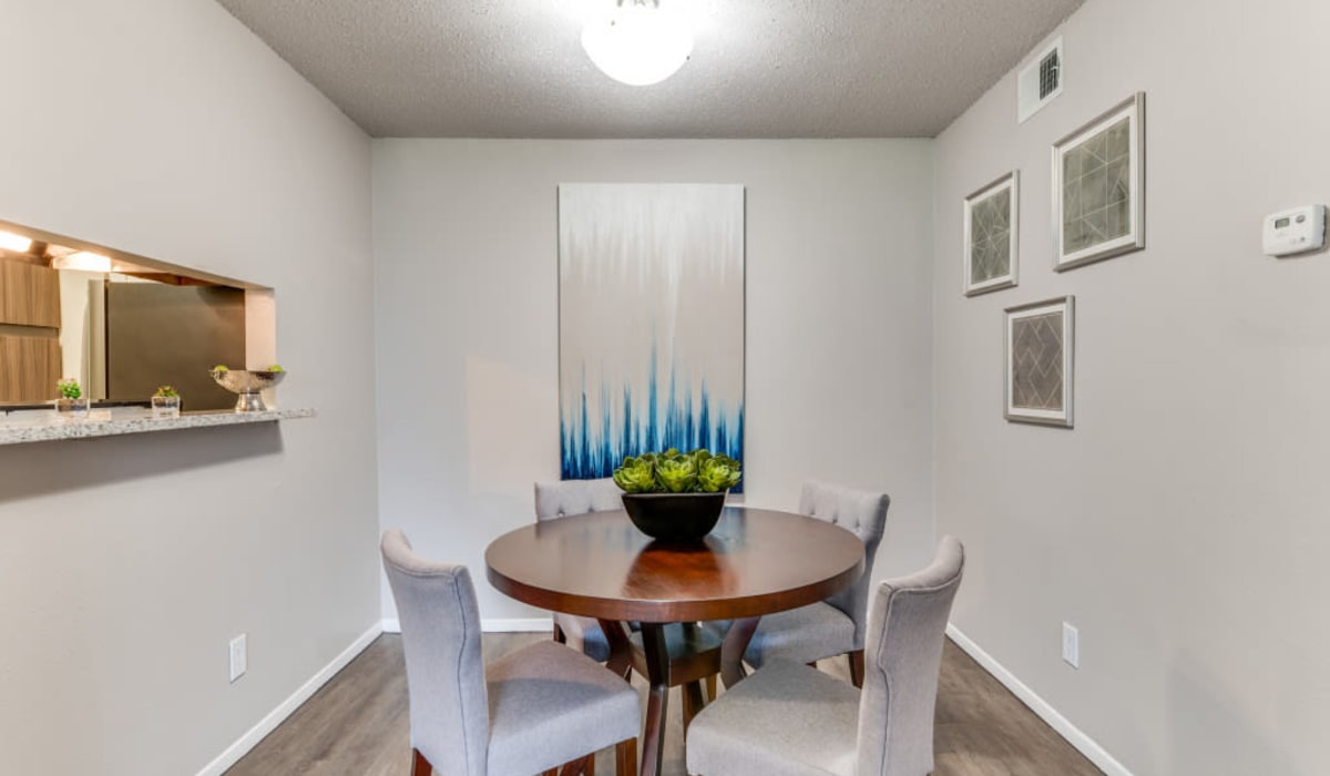 Dining room with window to kitchen at  Emmitt Luxury Apartments in Haltom City, Texas