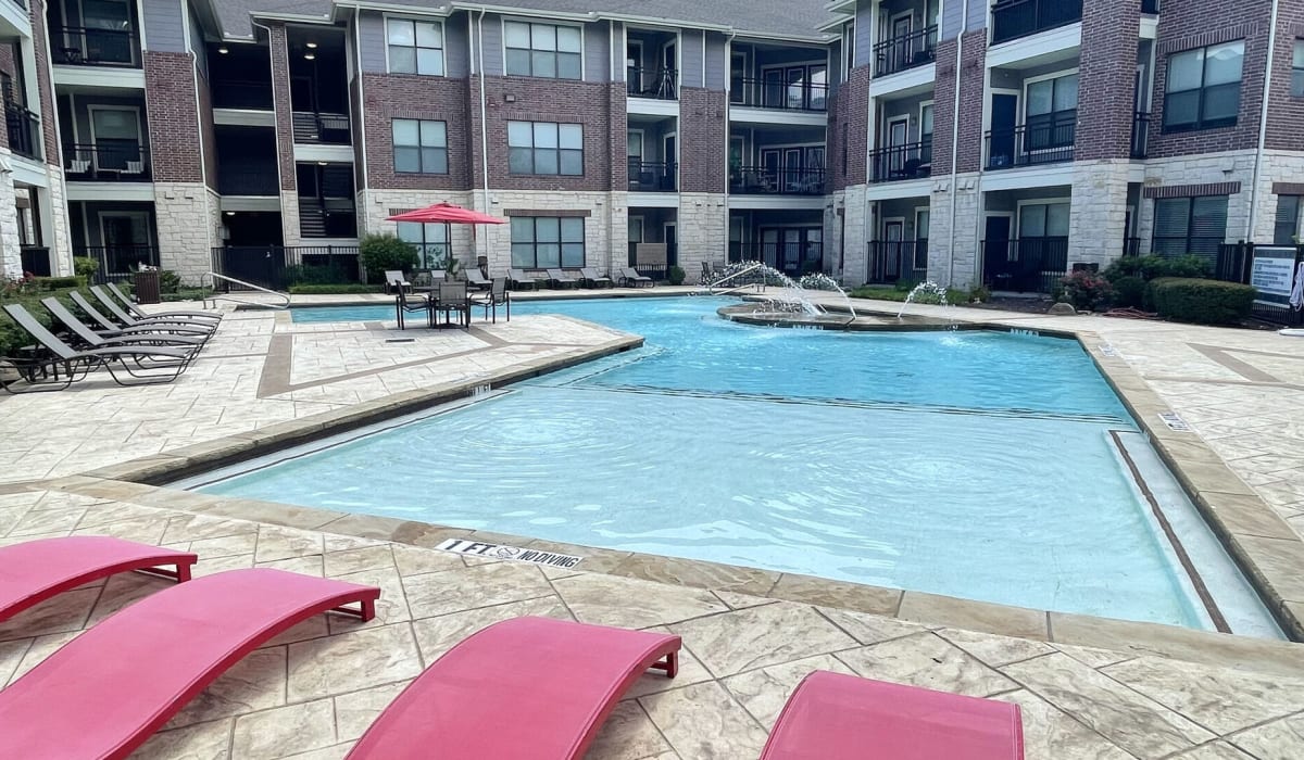Lounge seating facing the community swimming pool at Legends Lakeline in Austin, Texas