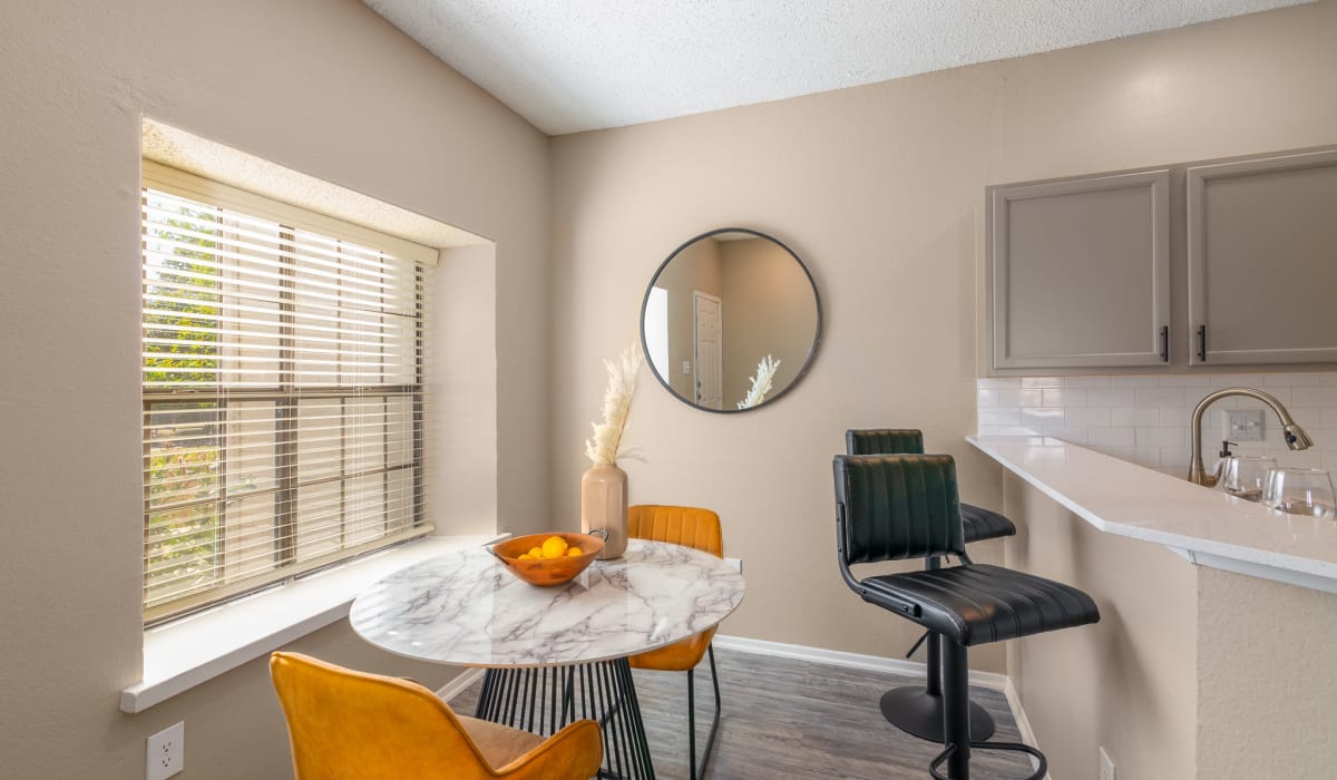 Dining room with breakfast bar at Knowlton Apartment Homes in Mesquite, Texas