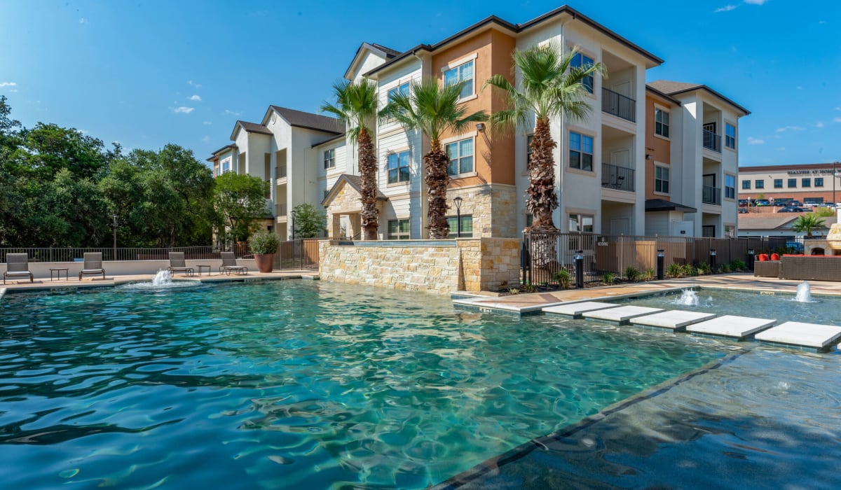 Exterior with outdoor pool at Alannah at Westover Hills in San Antonio, Texas