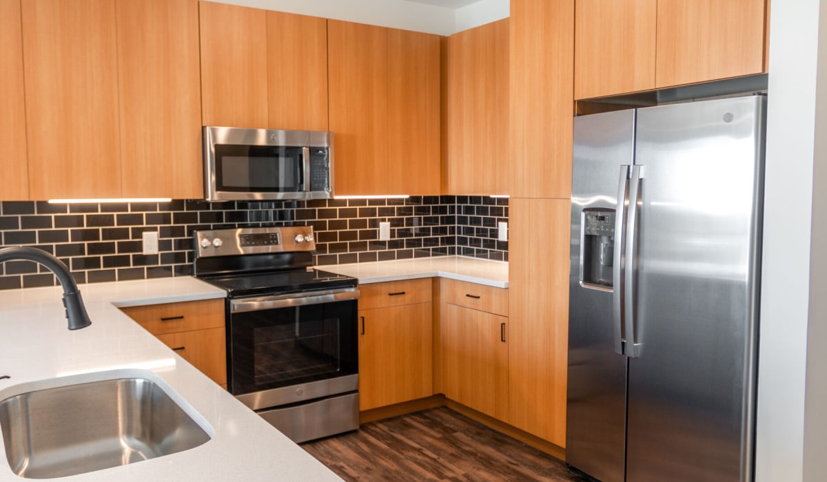 Model kitchen with stainless steel appliances at The Station at Middletown in Louisville, Kentucky