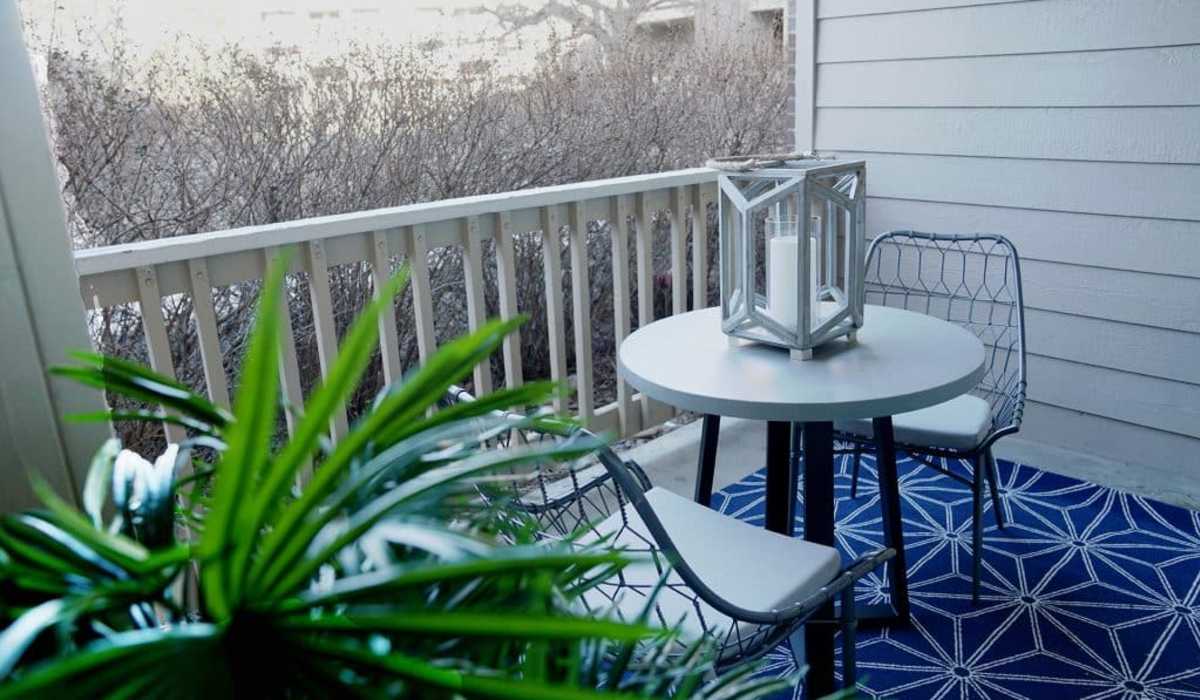 Separate balcony with chairs and round table at GrandView @ Flatirons in Louisville, Colorado