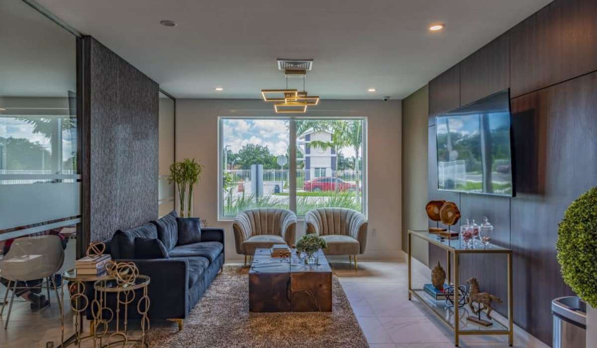 Bright living room with television at Palm Beach Preserve in West Palm Beach, Florida