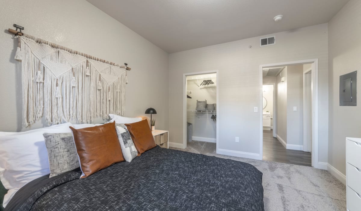 Bedroom with attached bathroom at Cobble Oaks Apartments in Gold River, California