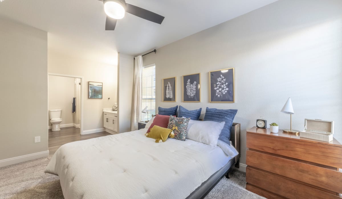 Bedroom with ceiling fan at Cobble Oaks Apartments in Gold River, California