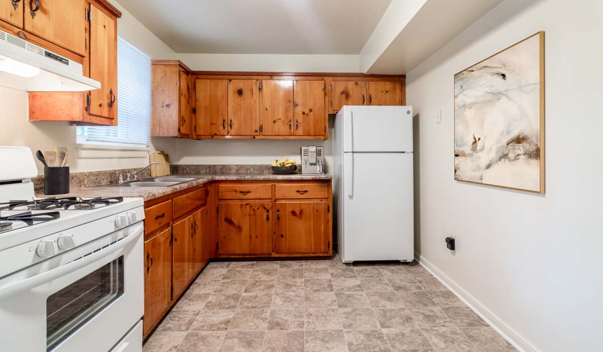 Kitchen with wood cabinets at Landmark at Tuckahoe in Henrico, Virginia