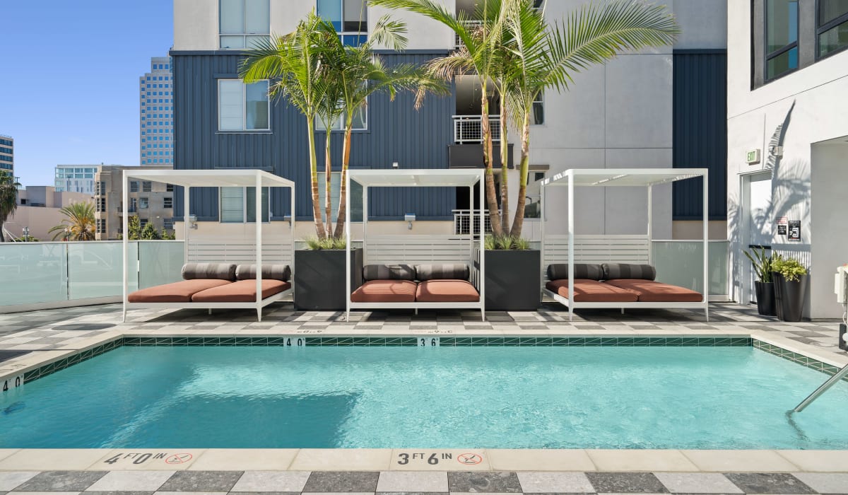 Elegant pools with garden sofa beds at Aster in Long Beach, California