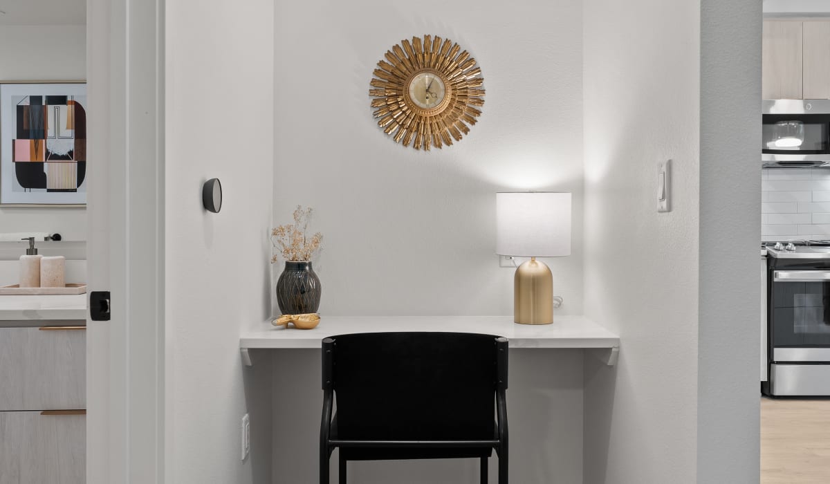 elegant white space with gold plated wall clock at Aster in Long Beach, California