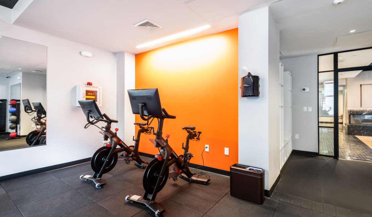 Community fitness center with stationary bikes at One India Street Apartments in Boston, Massachusetts