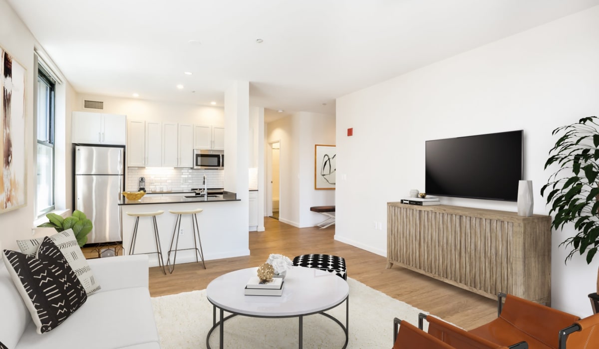 Open concept floor plan with eat-in kitchen and living room at One India Street Apartments in Boston, Massachusetts