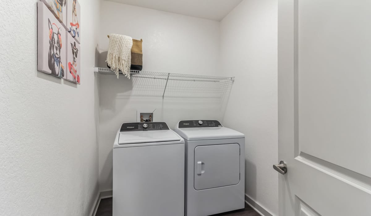 A full-sized washer and dryer in an apartment laundry room at Avocet at Melbourne in Melbourne, Florida