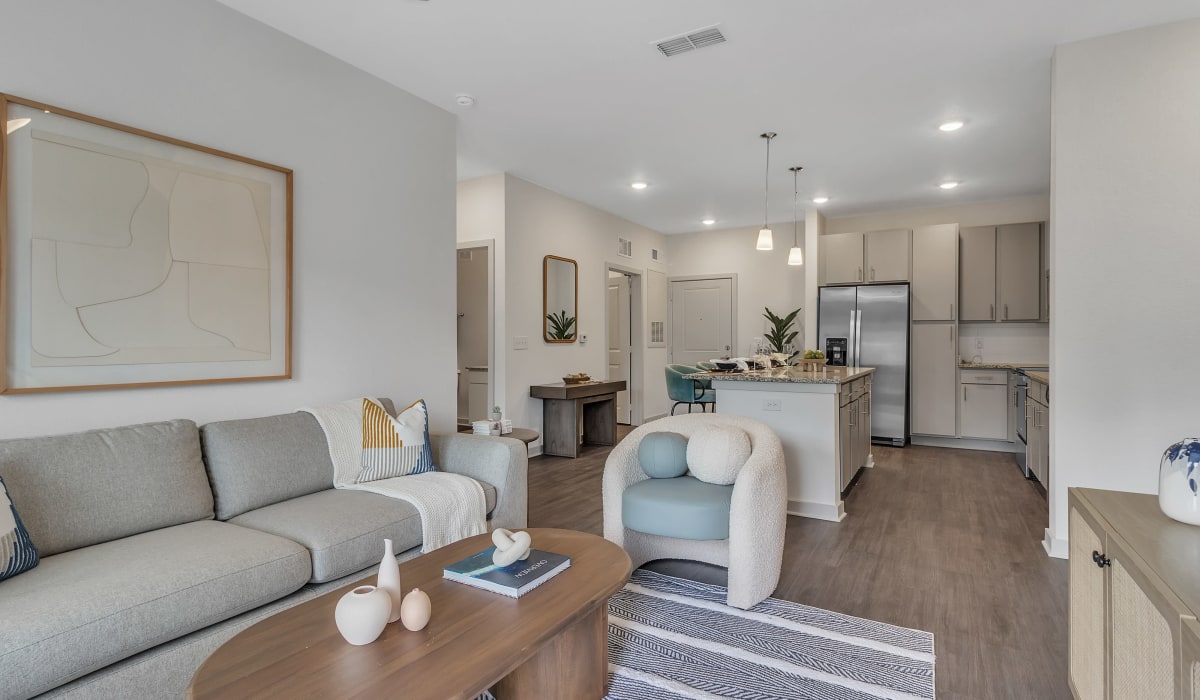 Wood flooring in a furnished apartment living room and kitchen at Avocet at Melbourne in Melbourne, Florida