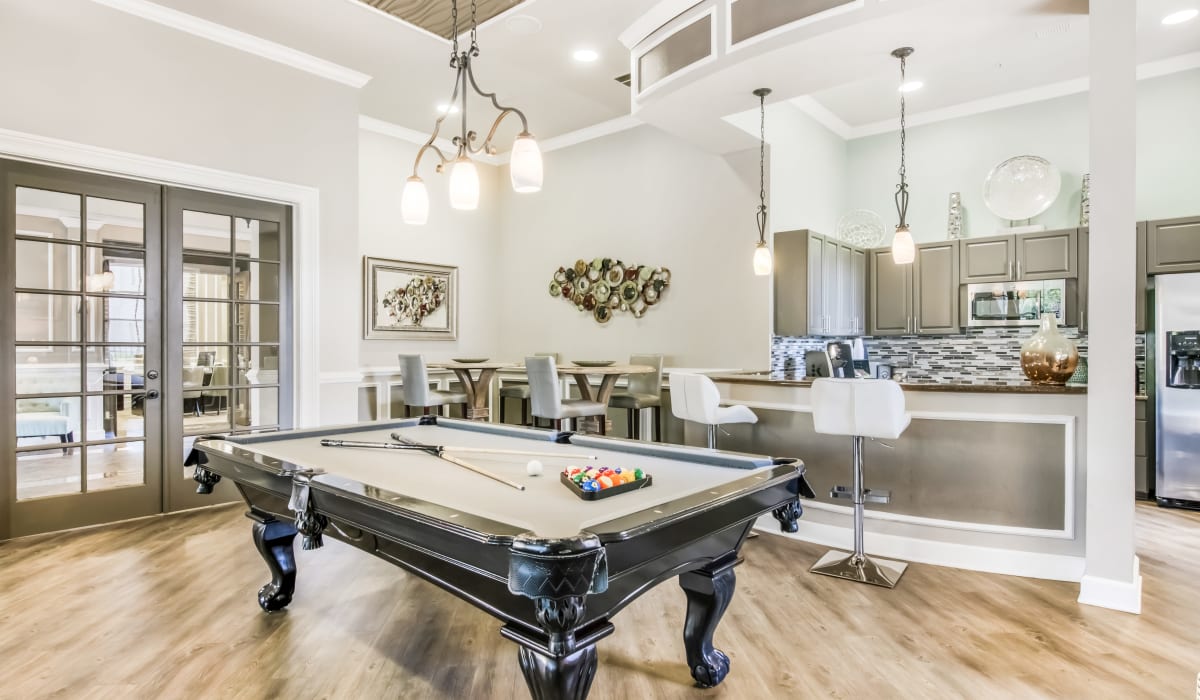 Clubhouse game area at Heritage on Millenia Apartments in Orlando, Florida