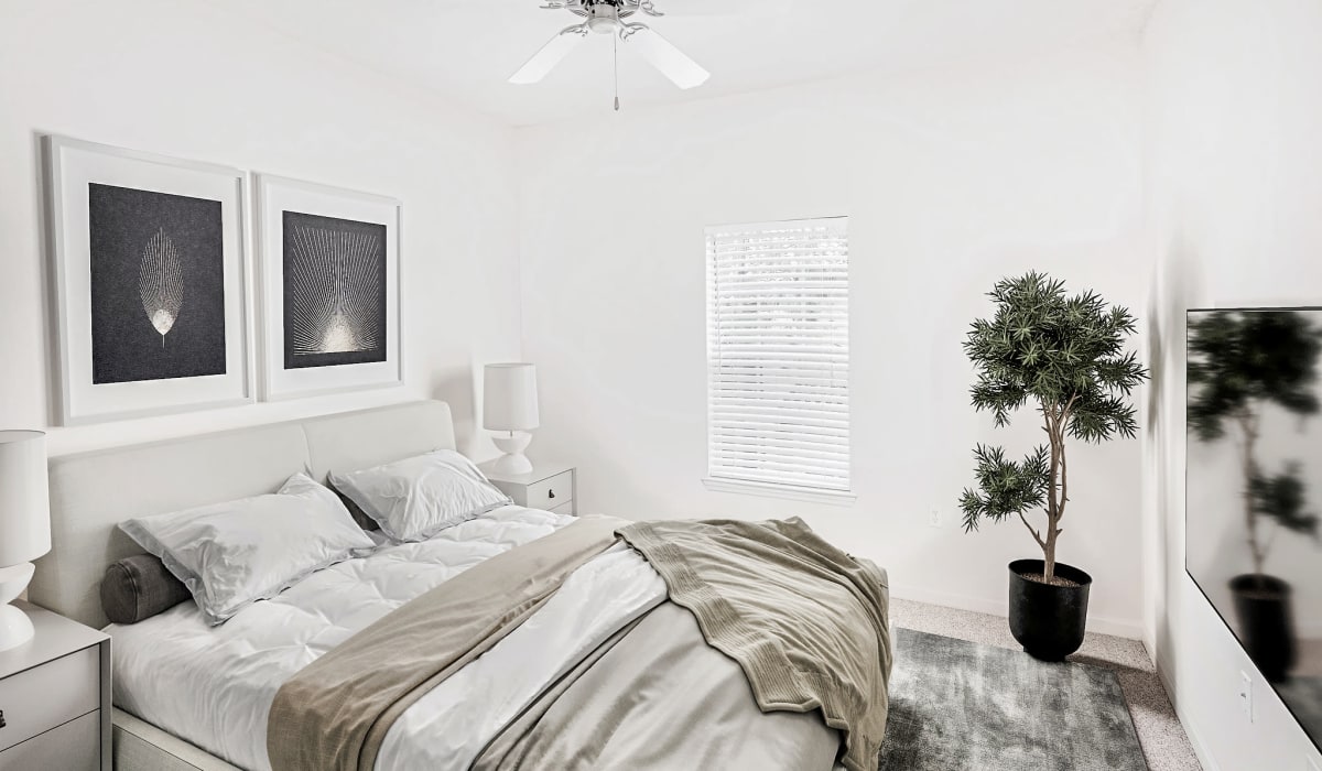 Cozy bedroom at Heritage on Millenia Apartments in Orlando, Florida