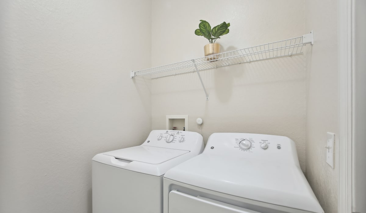 Laundry room at Heritage on Millenia Apartments in Orlando, Florida