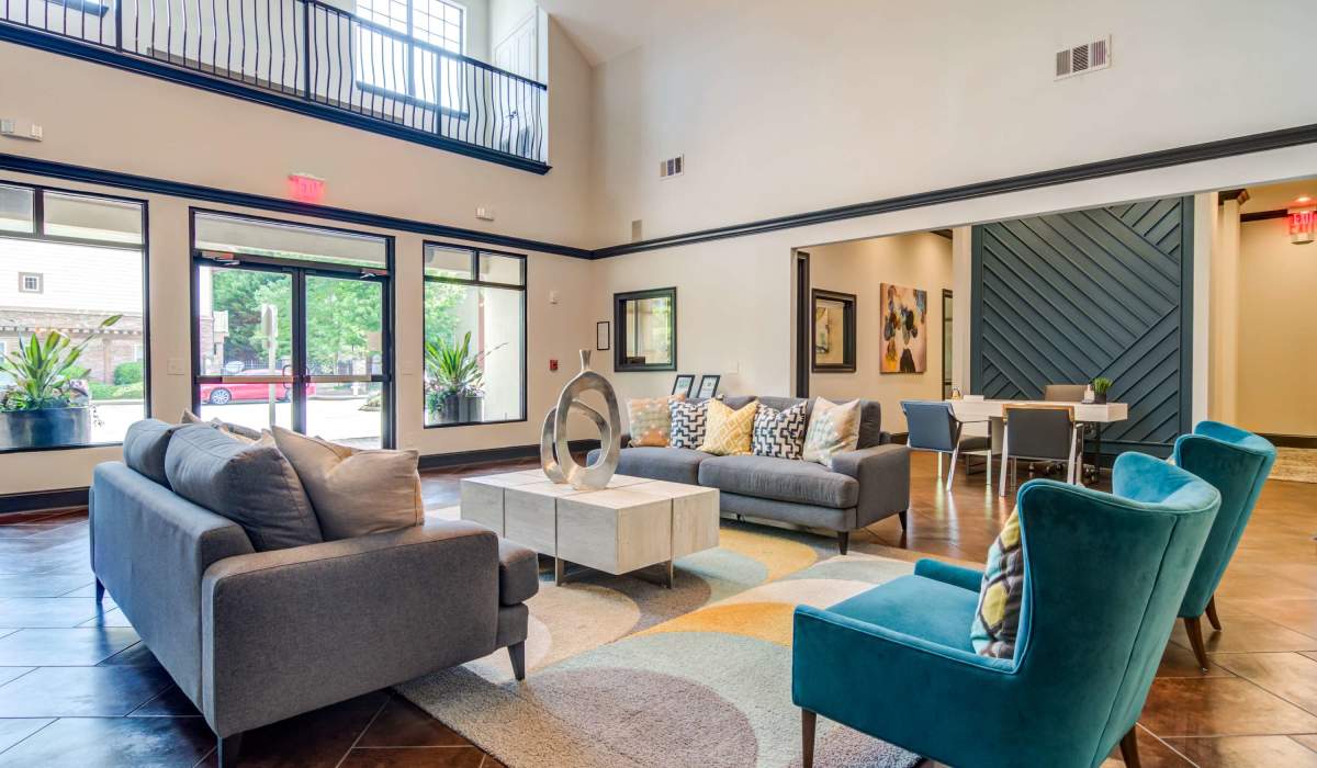Community gathering area with multiple couches and chairs at The Reserve at Johns Creek Walk in Johns Creek, Georgia