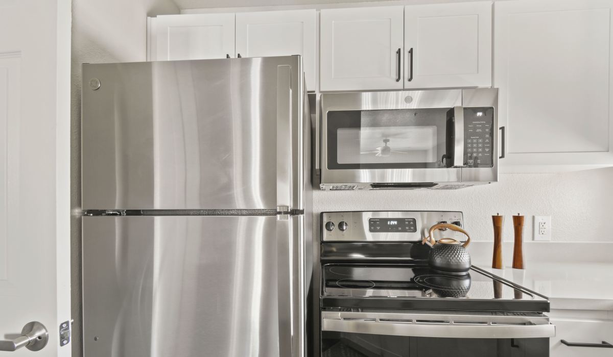 Stainless steel appliances in a modern kitchen at La Serena at Toscana in Phoenix, Arizona