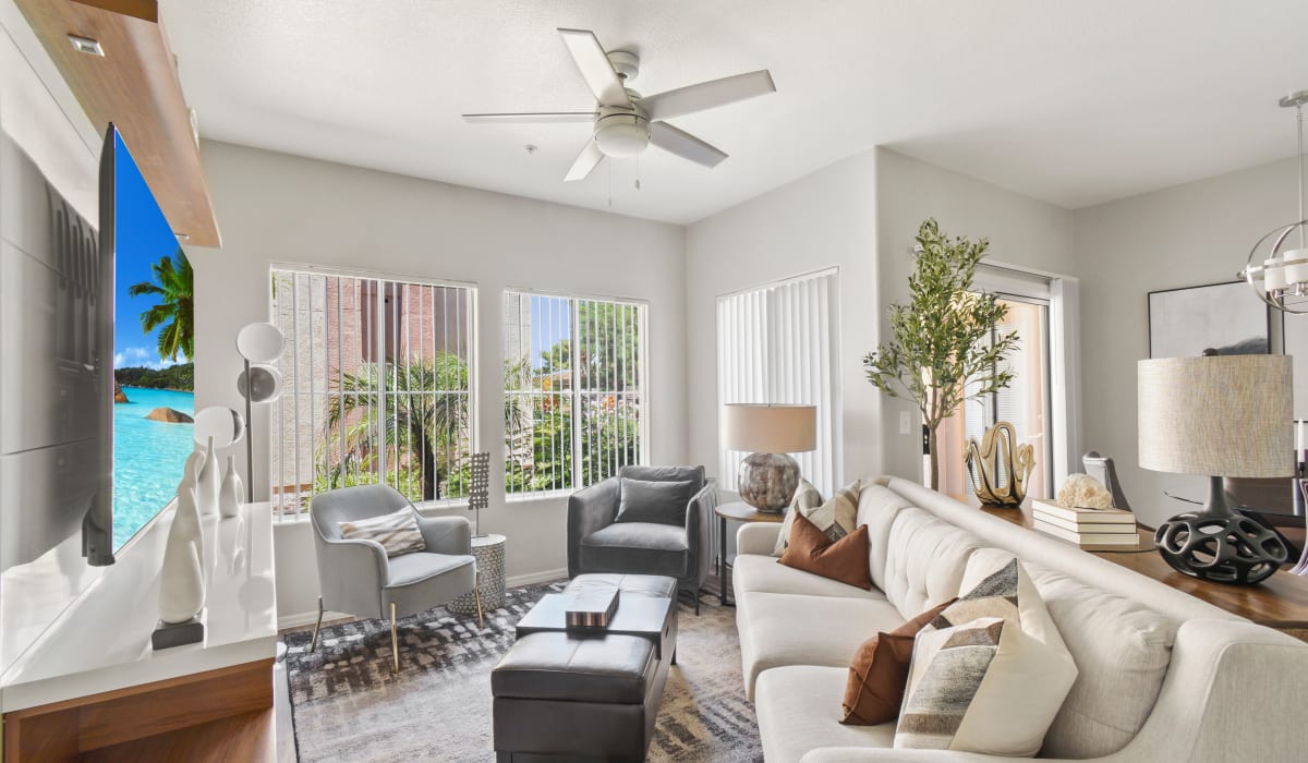 Model living room with a ceiling fan at La Serena at Toscana in Phoenix, Arizona