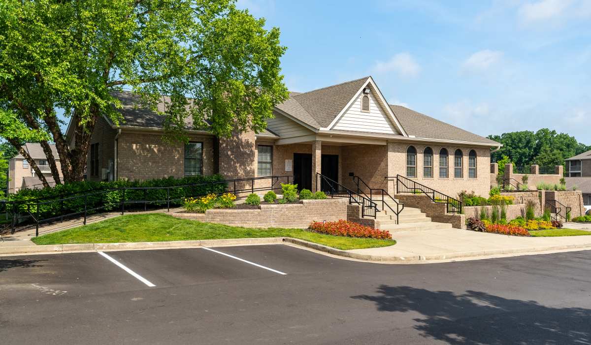 Brick building with landscaped entrance at Burlington Oaks in Burlington, Kentucky