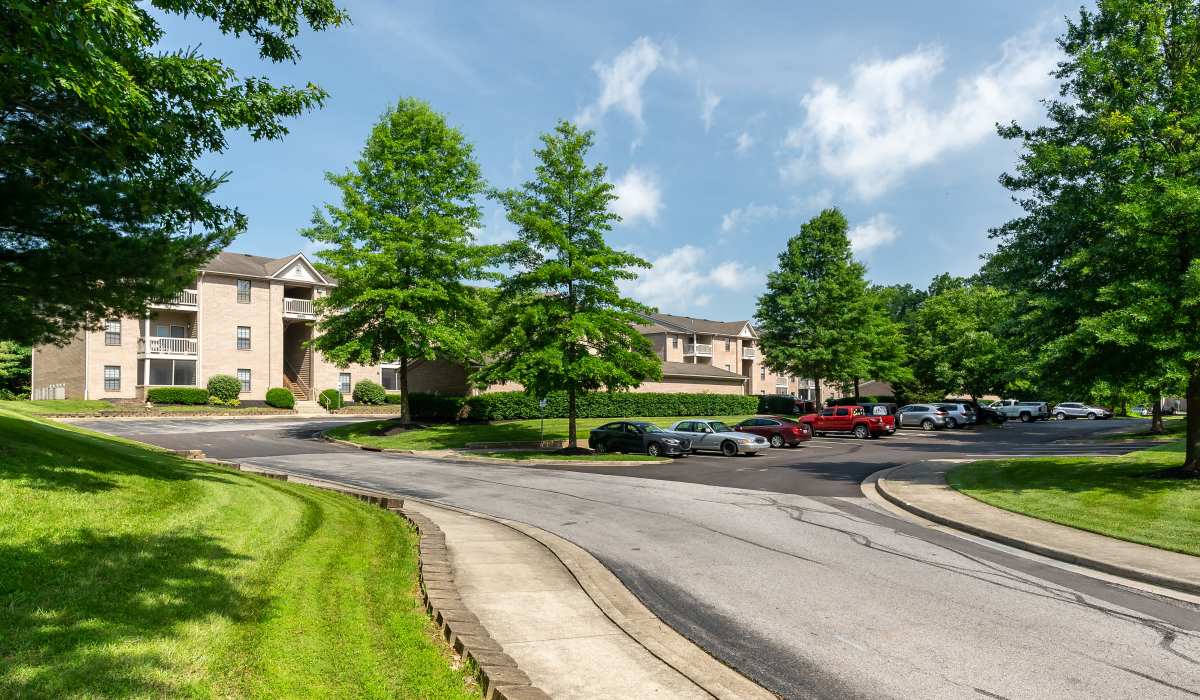 Apartment community with landscaped grounds and parking area at Burlington Oaks in Burlington, Kentucky