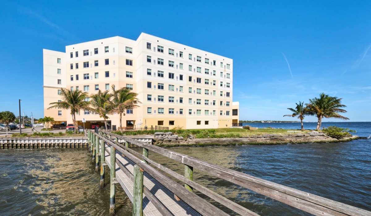 Exterior of Grand Villa of Palm Bay in Palm Bay, Florida and the surrounding water at Grand Villa of Palm Bay in Palm Bay, Florida