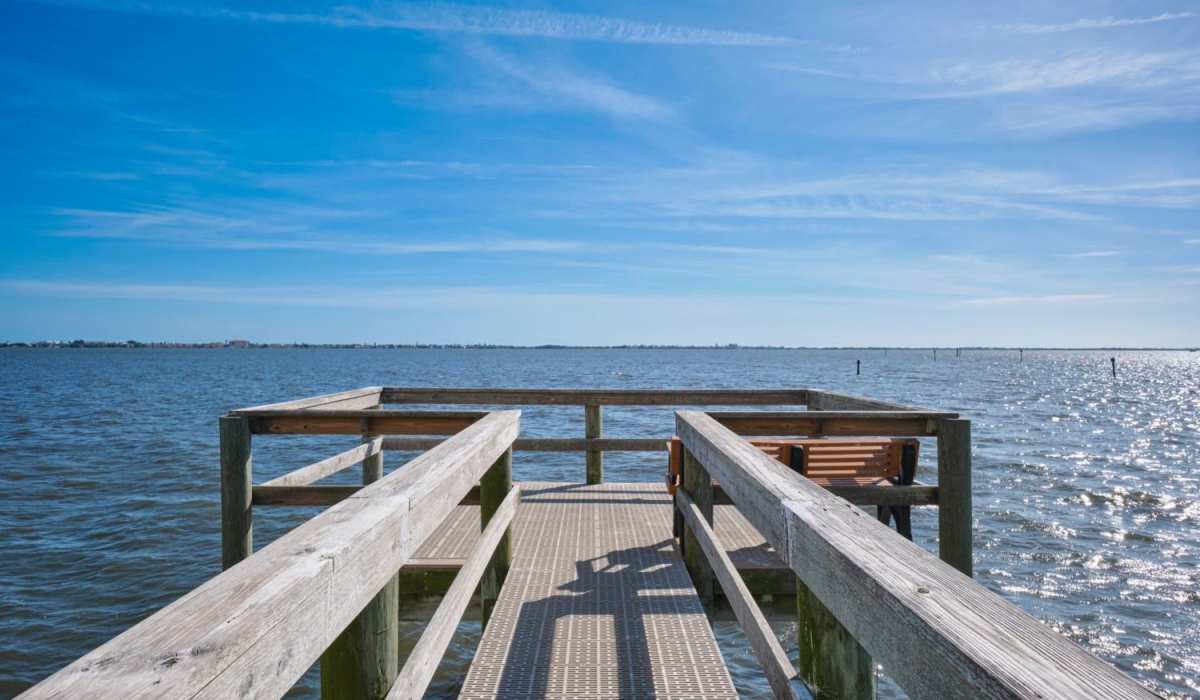 The wooden dock outside of Grand Villa of Palm Bay in Palm Bay, Florida