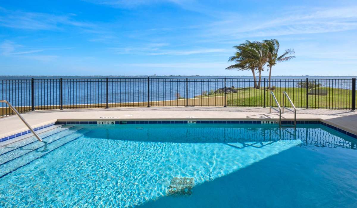 The sparkling swimming pool at Grand Villa of Palm Bay in Palm Bay, Florida