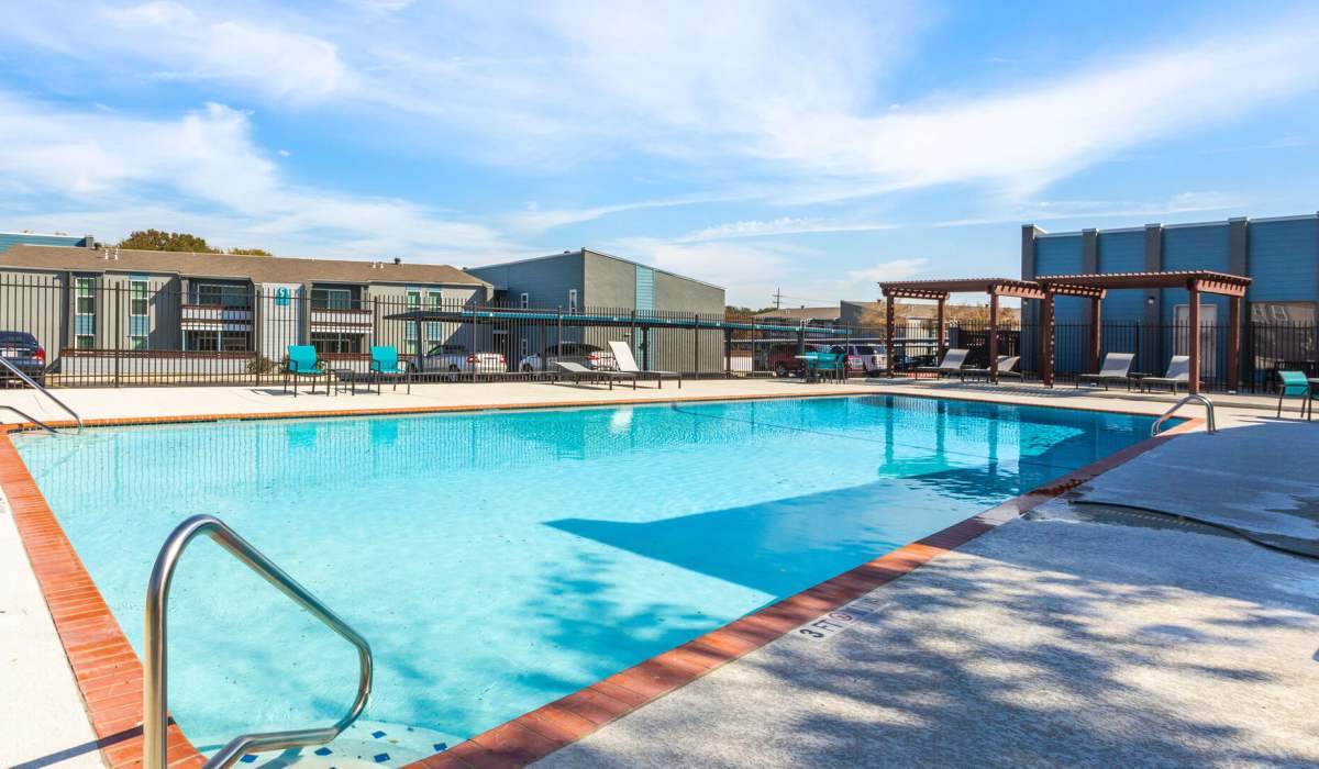 Resort-style swimming pool and sundeck at  Auburn Creek in San Antonio, Texas