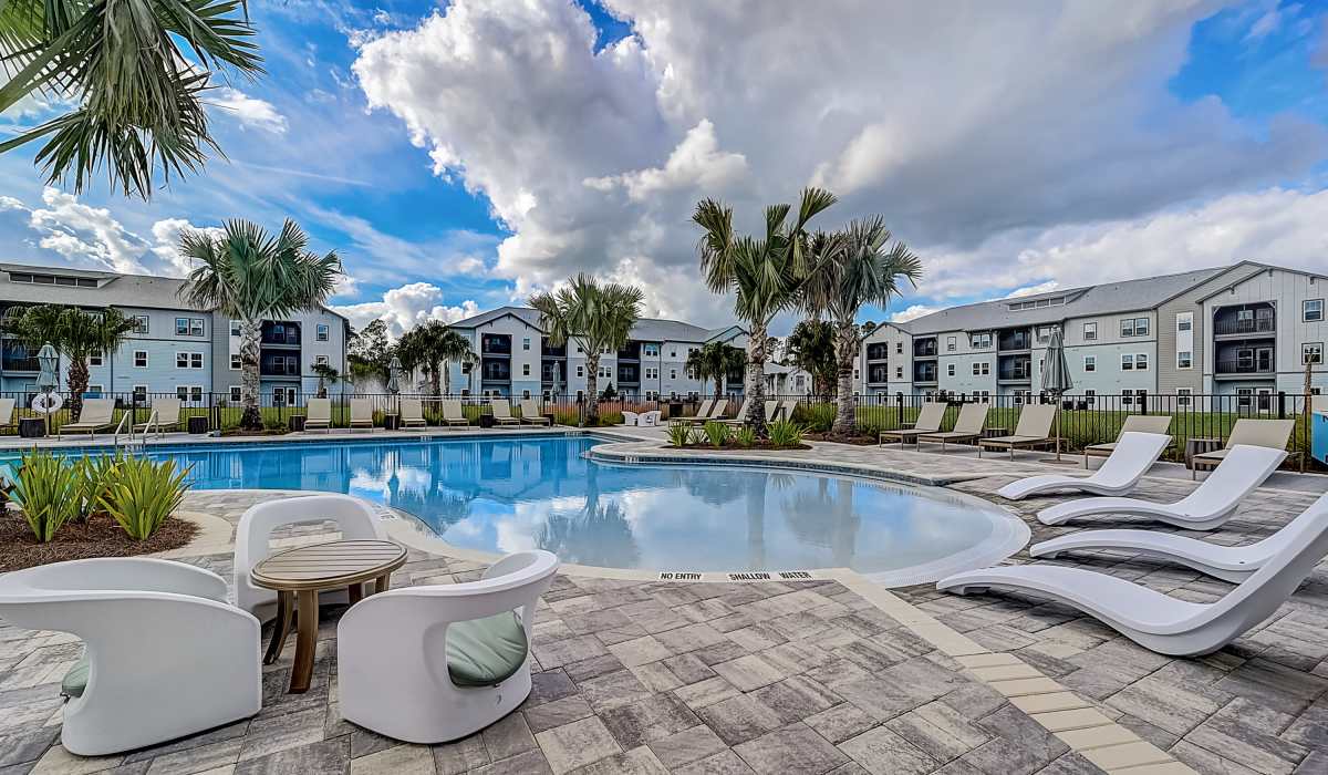 Swimming pool and lounge chairs at Collins Preserve in Jacksonville, Florida