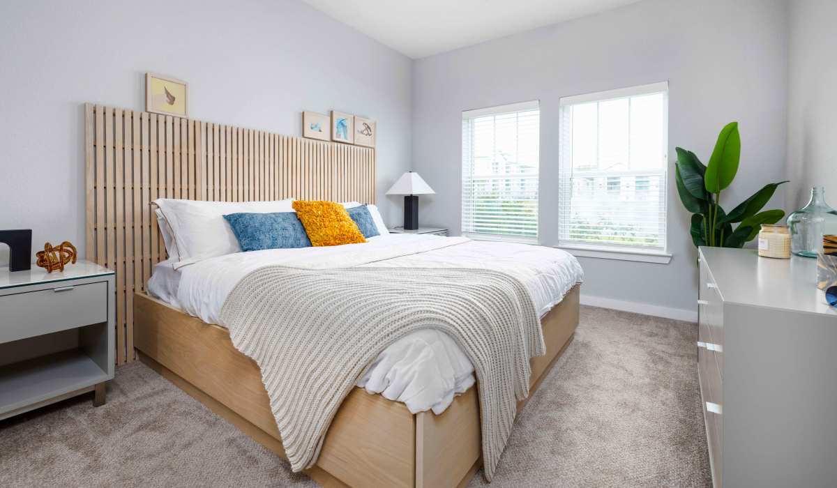 Bedroom with carpeted flooring in a model home at Collins Preserve in Jacksonville, Florida