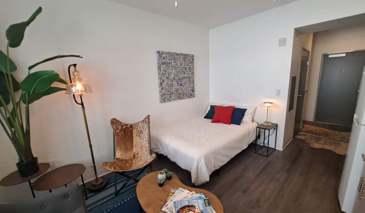 Studio apartment with wood-style flooring at Koz on 13th in Portland, Oregon